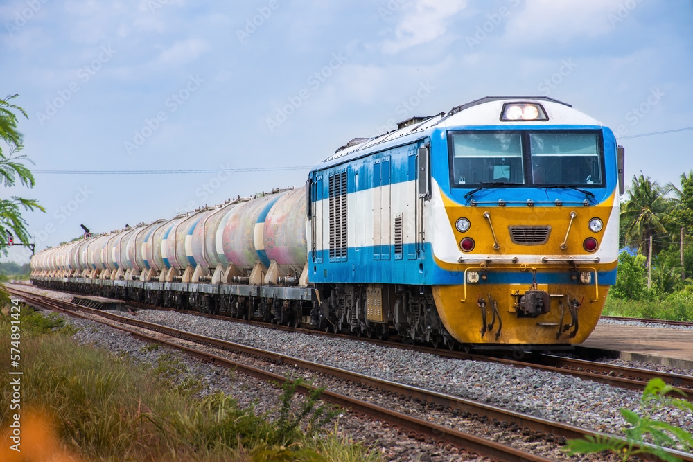 Tanker-freight train by diesel locomotive on the railway. Tanker-freight train by diesel locomotive on the railway.