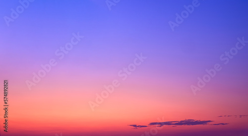 Colorful Dusk Sky in the Evening with beautiful romantic orange and yellow sunlight on dark blue Twilight sky background