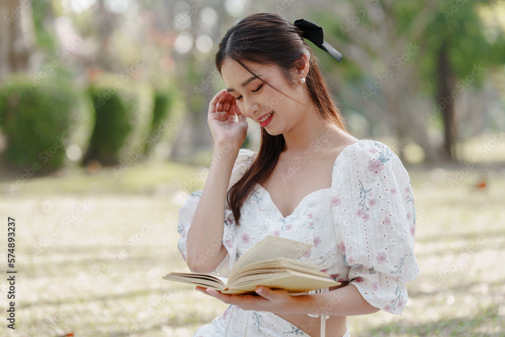 Fototapeta premium Two pretty asian friends woman picnic at park outdoor in relax time holiday, holiday recreation concept.