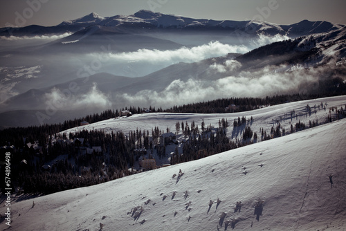 Carpathian mountain ski resort landscape photo. Nature scenery photography with highest peak on background. Ambient light. High quality picture for wallpaper, travel blog, magazine, article