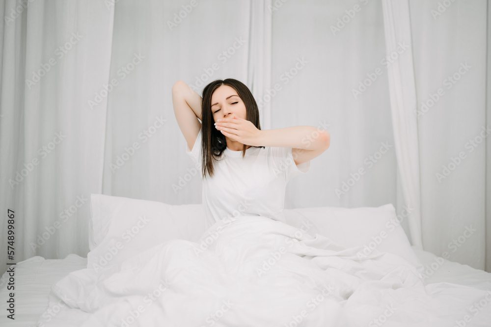 Image of beautiful woman resting in white bed at bedroom. in morning . Lifestyle at home concept. Image of beautiful woman resting in white bed at bedroom. in morning . Lifestyle at home concept.