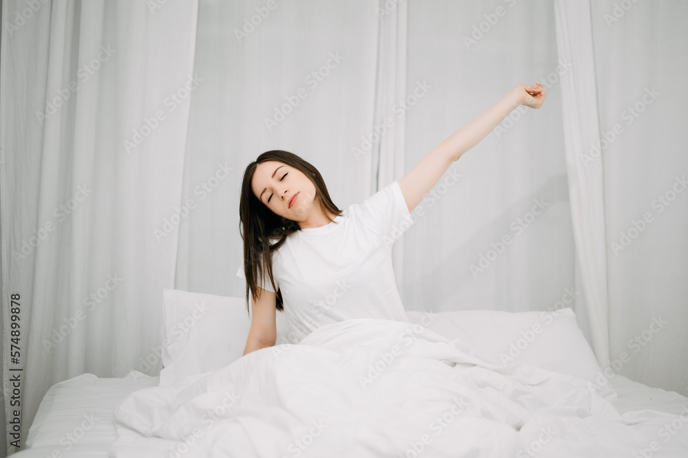 Image of beautiful woman resting in white bed at bedroom. in morning . Lifestyle at home concept. Image of beautiful woman resting in white bed at bedroom. in morning . Lifestyle at home concept.