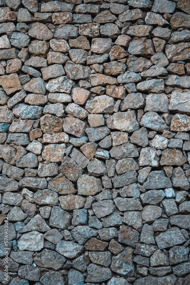 Masonry wall of stones with irregular pattern texture background Masonry wall of stones with irregular pattern texture background