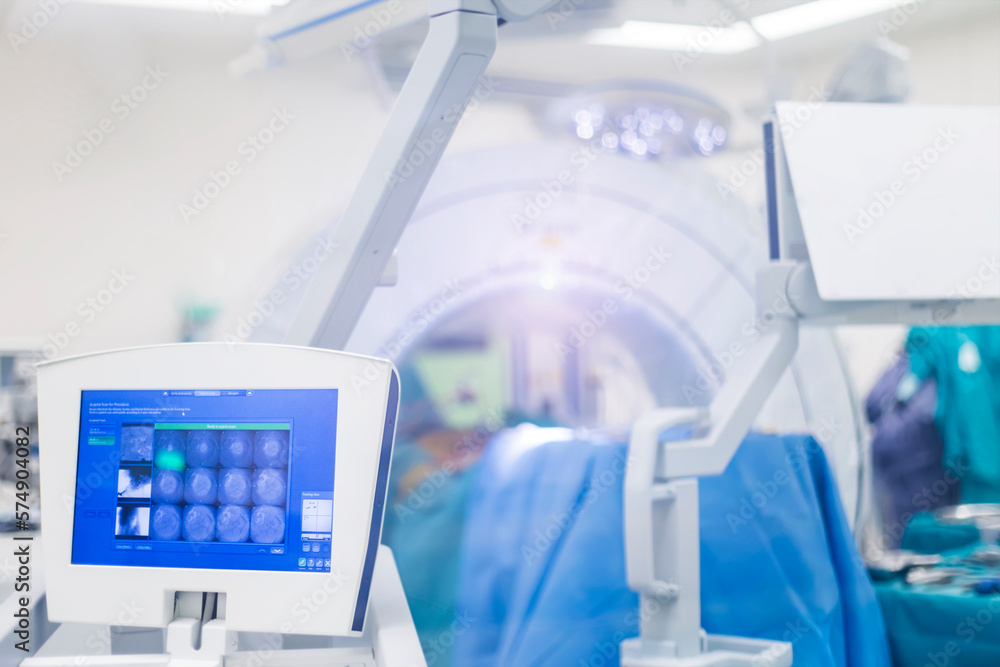 Intraoperative computer tomography machine inside modern operating room for advanced spine surgery.Selective focus is intended to blur background.Spinal surgery in orthopedic hospital.Medical concept. Intraoperative computer tomography machine inside modern operating room for advanced spine surgery.Selective focus is intended to blur background.Spinal surgery in orthopedic hospital.Medical concept.