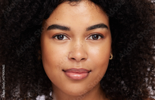 Portrait, beauty and afro with a model black woman in studio for skincare, haircare or cosmetics. Face, hair and natural with an attractive young female posing for skin treatment or antiaging care