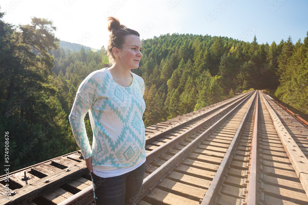 Portrait of pregnant woman standing on Goldstream Trestle in Goldstream Provincial Park Portrait of pregnant woman standing on Goldstream Trestle in Goldstream Provincial Park