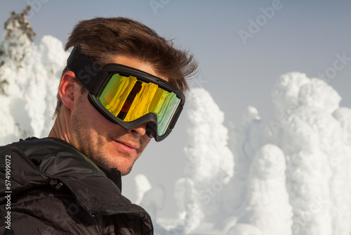 Snowshoer wearing goggles on Big White Mountain, British Columbia, Canada photo