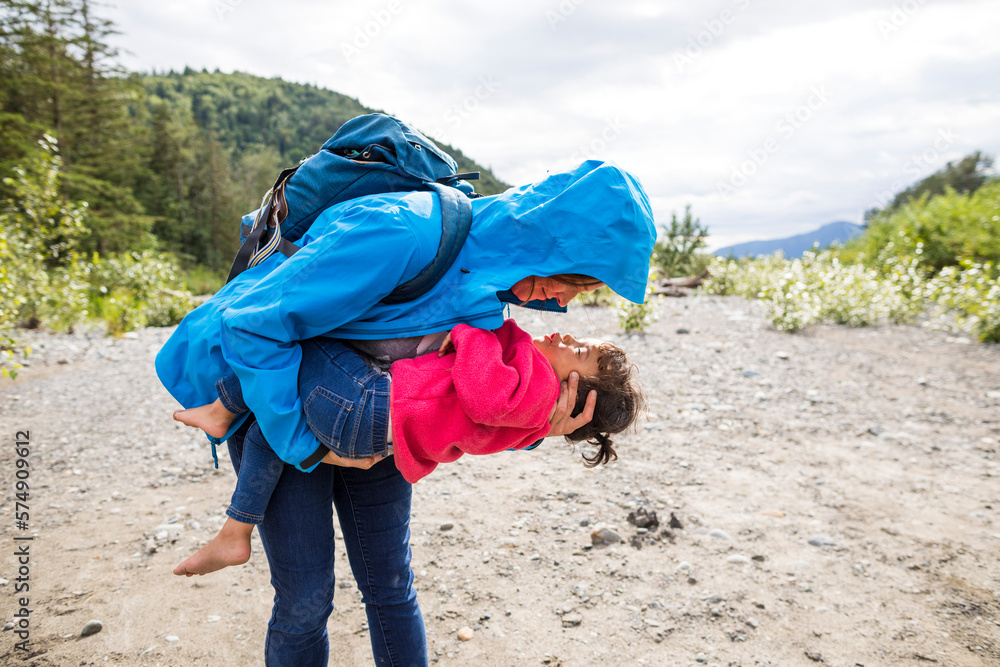 Mother playing with daughter while hiking Mother playing with daughter while hiking