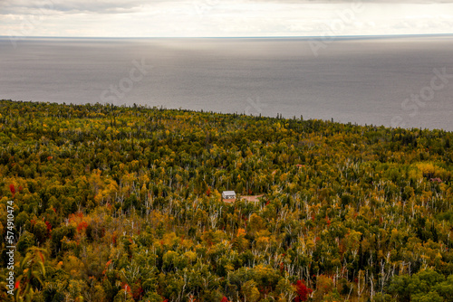 View of forest with log cabin, Oberg Mountain hiking trail, Tofte, Minnesota, USA photo