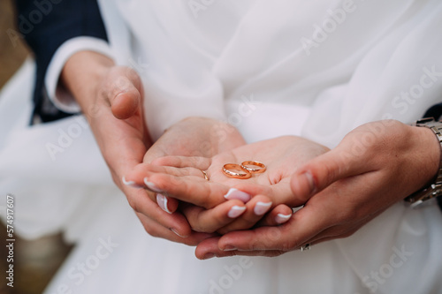 Hugging hands with rings of newlyweds 4416. photo