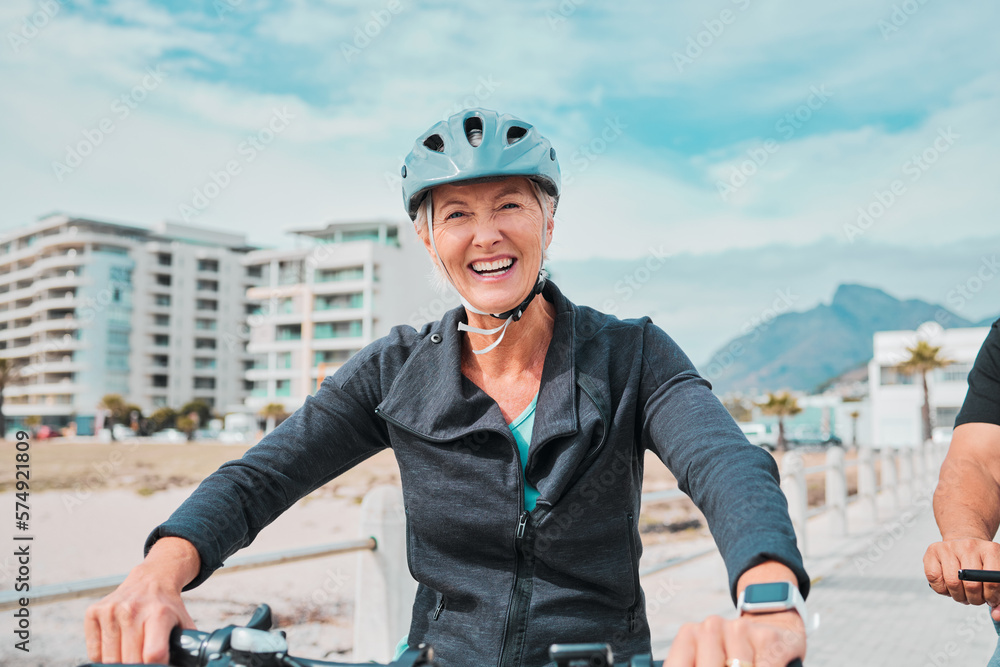Mature woman, bike or helmet portrait for beach promenade cycling in wellness exercise, fitness or cardiology healthcare. Smile, happy or elderly person in bicycle head safety or eco friendly workout Mature woman, bike or helmet portrait for beach promenade cycling in wellness exercise, fitness or cardiology healthcare. Smile, happy or elderly person in bicycle head safety or eco friendly workout