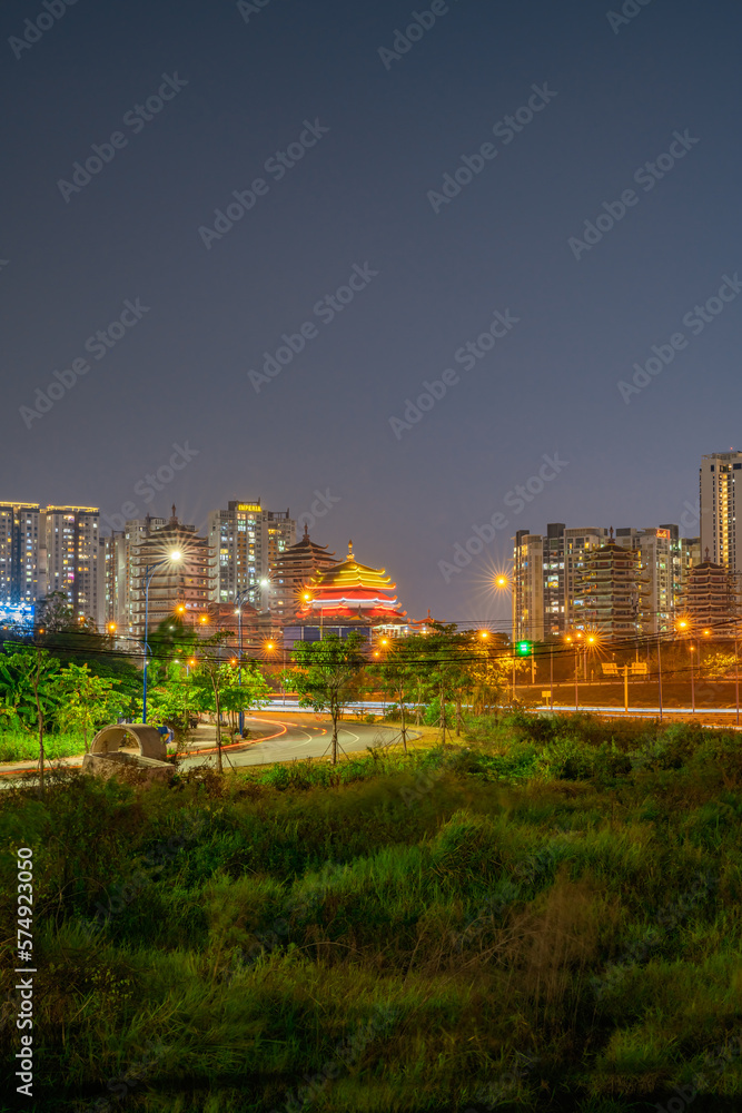 Fototapeta premium Beautiful sunset in Ho Chi Minh City, one of the most developed cities in Vietnam. With many famous buildings and towers such as Bitexco, Landmark 81,....