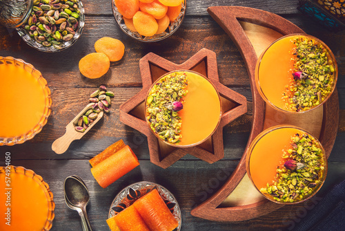 Arabic Cuisine; Dry Apricot Pudding (Qamar Al Deen). Middle Eastern apricot pudding topped with crushed pistachio. It is one of the most famous Ramadan dessert recipe. photo