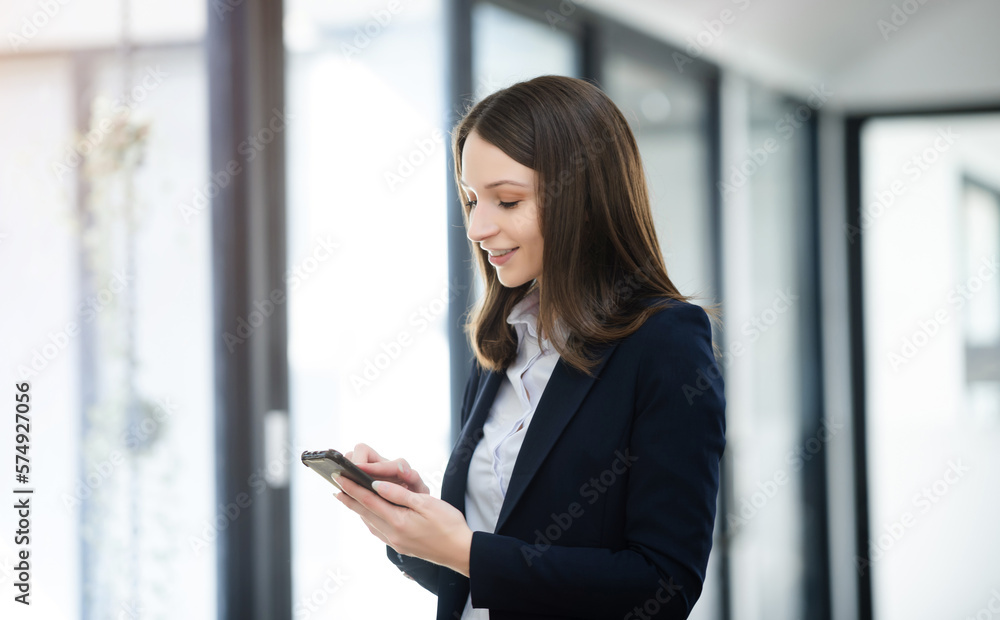 Working woman concept a female manager attending video conference and holding tablet, smatrphone and cup of coffee in office Working woman concept a female manager attending video conference and holding tablet, smatrphone and cup of coffee in office