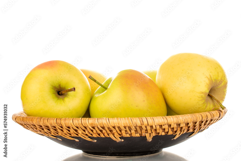 Several ripe juicy apples on a ceramic plate, macro, isolated on white background. Several ripe juicy apples on a ceramic plate, macro, isolated on white background.
