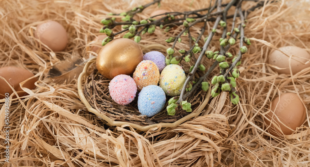 Colorful Easter eggs in the nest rotate. Greeting card with quail eggs and chicken eggs. Happy Easter holiday. Christian celebration, family traditions, flat lay top view Colorful Easter eggs in the nest rotate. Greeting card with quail eggs and chicken eggs. Happy Easter holiday. Christian celebration, family traditions, flat lay top view