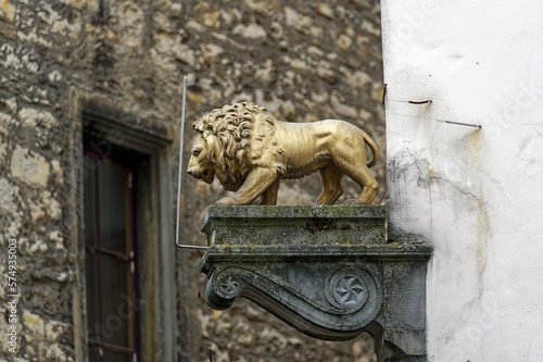 Decoration at facade of historic house with lion statue at alley at the old town of Swiss City of Schaffhausen on a foggy winter day. Photo taken February 16th, 2023, Schaffhausen, Switzerland.