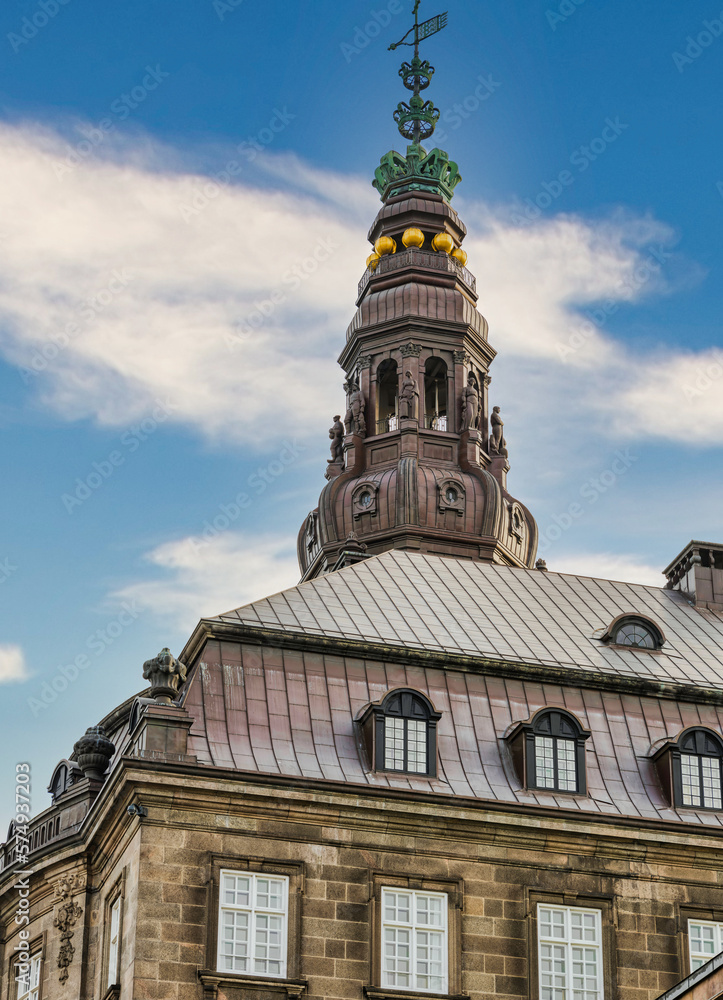 Christiansborg Palace tower with blue sky and white clouds, Copenhagen, Denmark