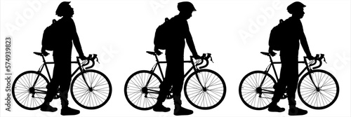 A man in a sports protective helmet and with a backpack on his back walks with a bicycle. The guys on a bike ride walk one after another. Side view. Three silhouettes, black color isolated on white