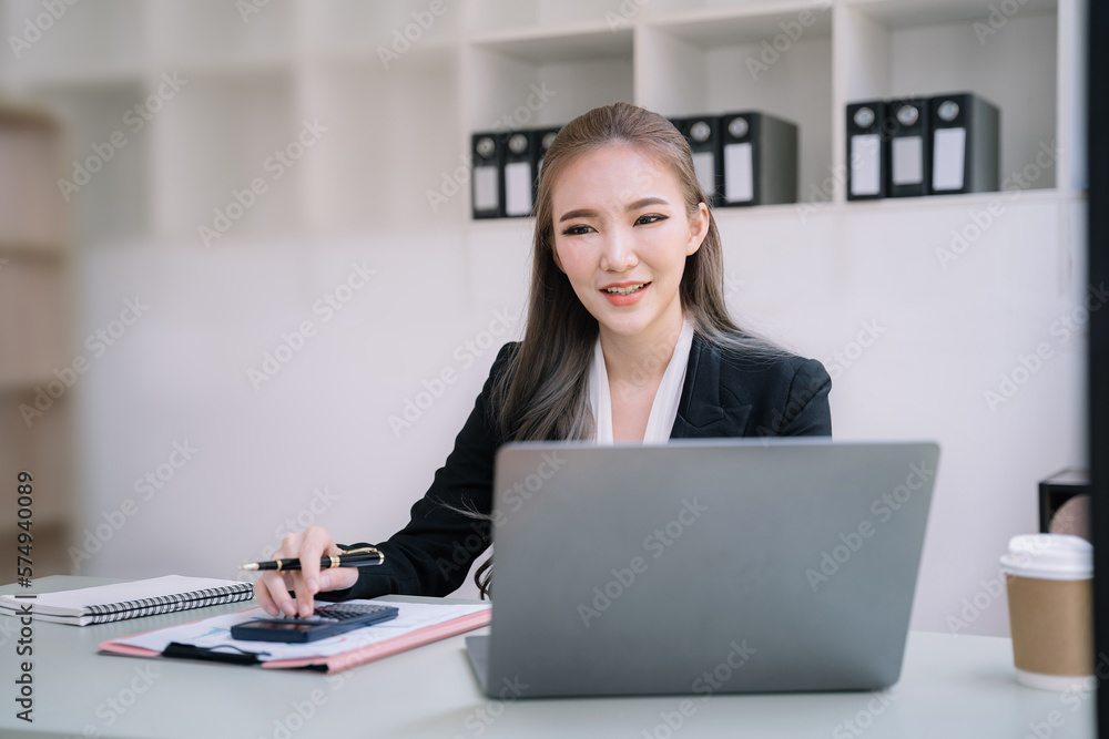 Female businessman and financial concepts about office work. Analysts discuss business with tablet and calculator as a tool. Female businessman and financial concepts about office work. Analysts discuss business with tablet and calculator as a tool.