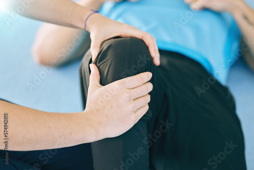 Knee pain, physiotherapy and hands of coach with man for performance, body wellness and sports. Fitness, physical therapy and personal trainer with athlete for muscle tension, injury and stretching