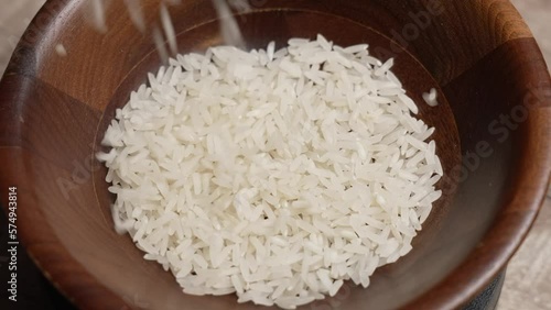 Uncooked Rice Being Poured