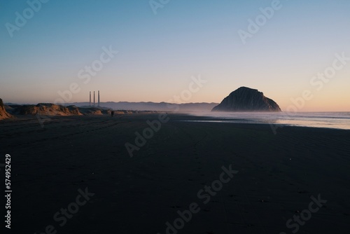 dusk at the beach in california with an island in the back