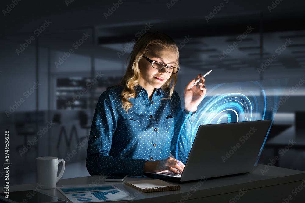 Beautiful blonde in dark office working on laptop and getting net access Beautiful blonde in dark office working on laptop and getting net access