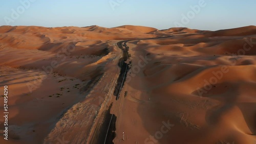 Asphalt road in sand dunes of Liwa desert, Abu-Dhabi, UAE photo