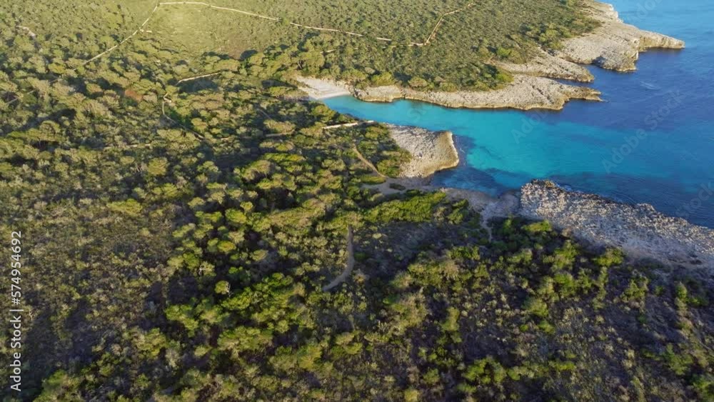 Aerial view of Son Saura Beach with clear blue water in Menorca Spain Aerial view of Son Saura Beach with clear blue water in Menorca Spain