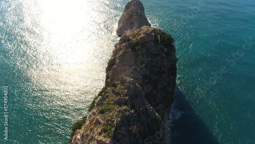 Beautiful Taurus Mountains range is overwashed by Mediterranean sea in sunny town Alanya. Antalya Province in Turkey. Moving copter view. photo