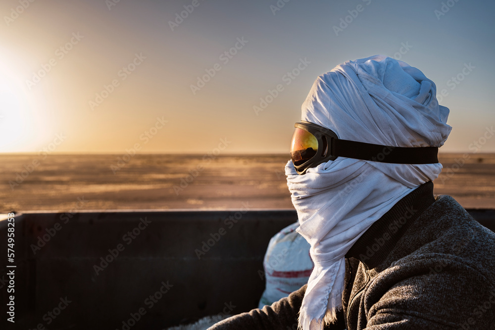 Mauritanian man in traditional headscarf in desert Mauritanian man in traditional headscarf in desert