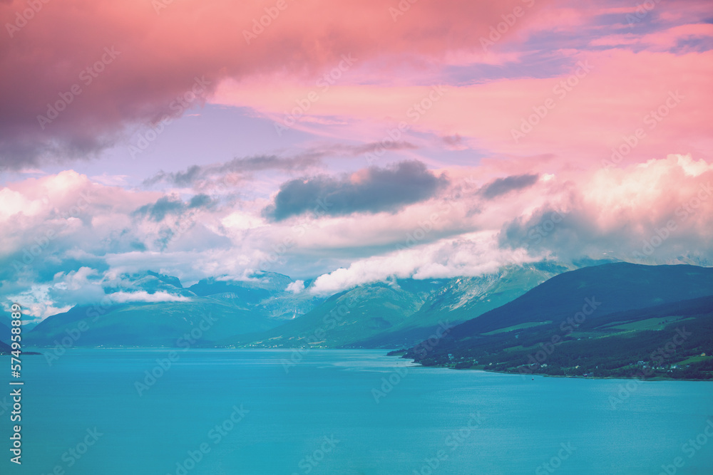 Fjord at sunset. Rocky seashore in the evening. Beautiful nature of Norway. Picturesque Scandinavian landscape. Lofoten islands, Norway Fjord at sunset. Rocky seashore in the evening. Beautiful nature of Norway. Picturesque Scandinavian landscape. Lofoten islands, Norway