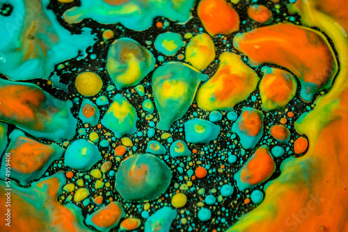 Vibrant multicolored drops of inks in oil