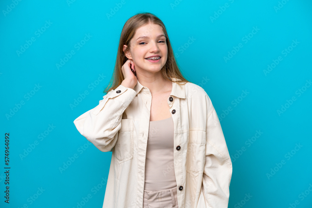 Teenager Russian girl isolated on blue background laughing Teenager Russian girl isolated on blue background laughing