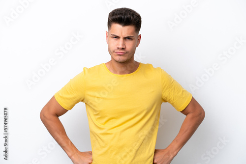Young caucasian man isolated on white background angry