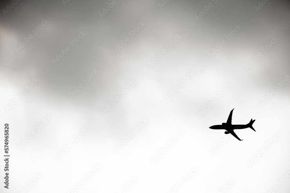 Commercial airplane taking off on a cloudy day Commercial airplane taking off on a cloudy day