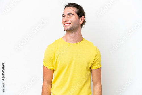 Caucasian handsome man isolated on white background looking to the side and smiling