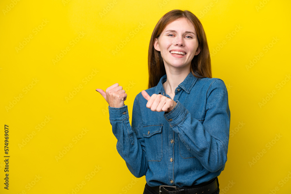 Young English woman isolated on yellow background pointing to the side to present a product Young English woman isolated on yellow background pointing to the side to present a product
