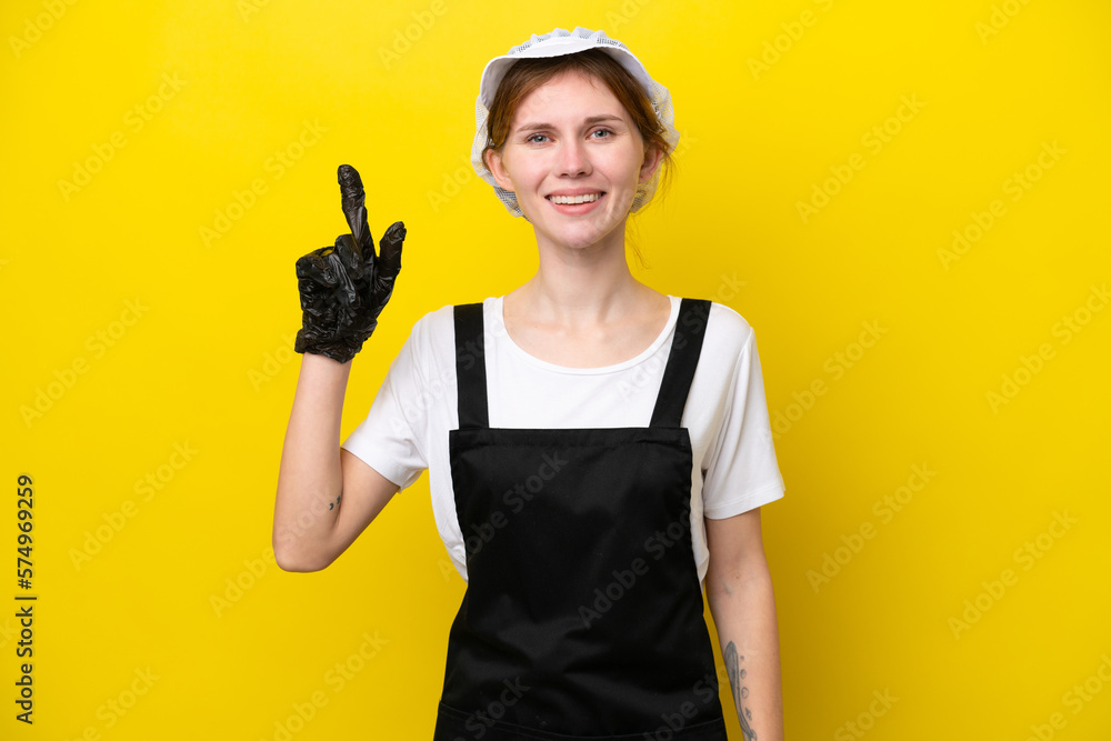 Young English fisherwoman isolated on yellow background pointing up a great idea Young English fisherwoman isolated on yellow background pointing up a great idea