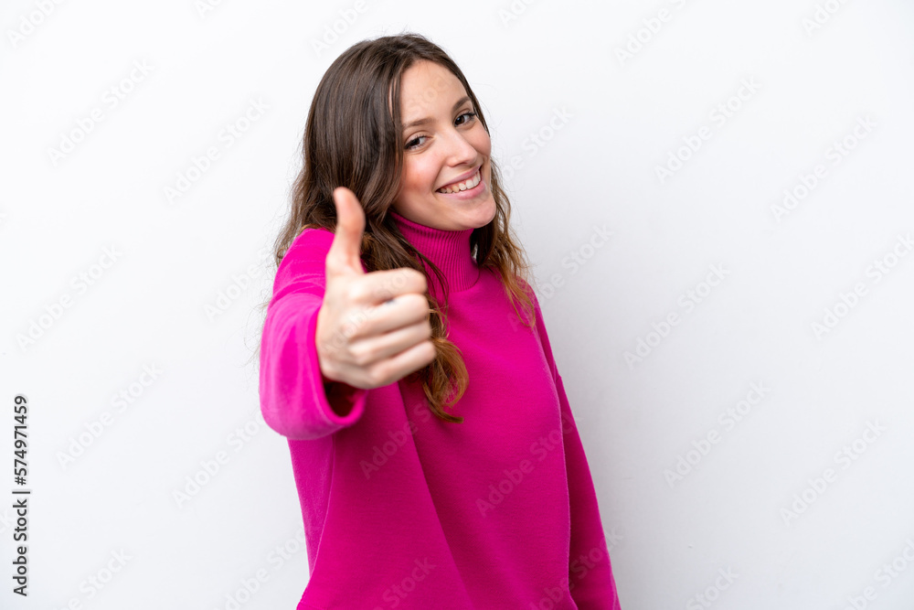 Young caucasian woman isolated on white background with thumbs up because something good has happened Young caucasian woman isolated on white background with thumbs up because something good has happened