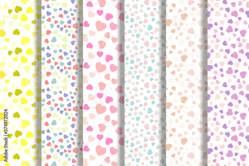 Set of vector seamless patterns of yellow, multicolored, pink, turquoise, pink hearts for fabric, textile, wallpapers, postcards, placards