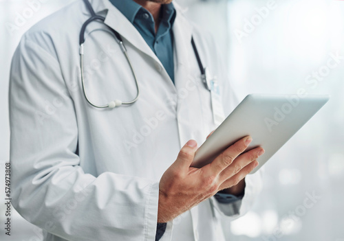 Healthcare, research and hands of doctor with tablet for wellness, medical abstract and analysis. Hospital, insurance and health worker on digital tech for internet, patient report and telehealth app