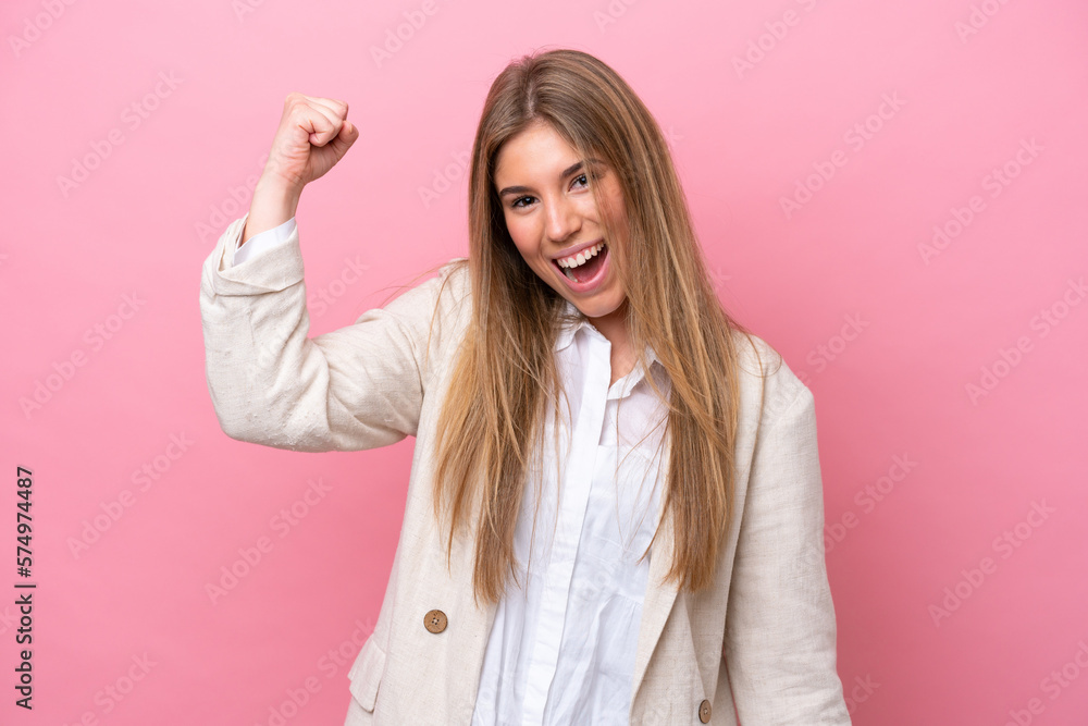Young caucasian woman isolated on pink bakcground celebrating a victory Young caucasian woman isolated on pink bakcground celebrating a victory