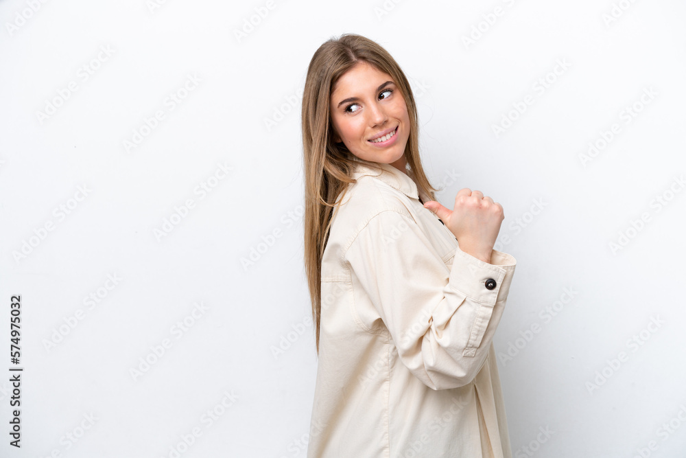 Young caucasian woman isolated on white bakcground pointing to the side to present a product Young caucasian woman isolated on white bakcground pointing to the side to present a product