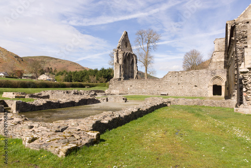 The ruins of Valle Crucis Abbey viewed dining hall. Founded as a Cistercian monastery in 1201 and closed in 1537 it is a prominent landmark in the vale of Llangollen Wales