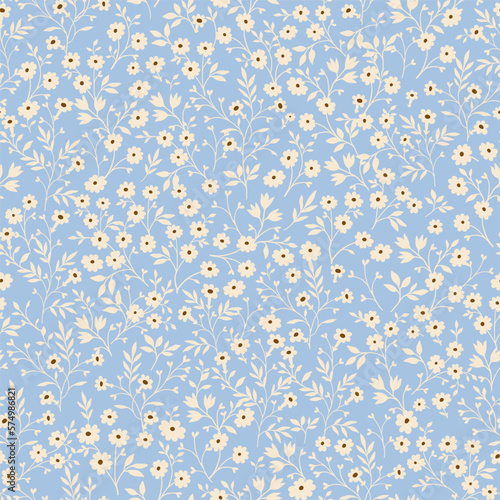 Vintage seamless tiny floral pattern. Blue background with small light yellow flowers. Design for wallpaper, clothing, packaging, fabric, cover, textiles