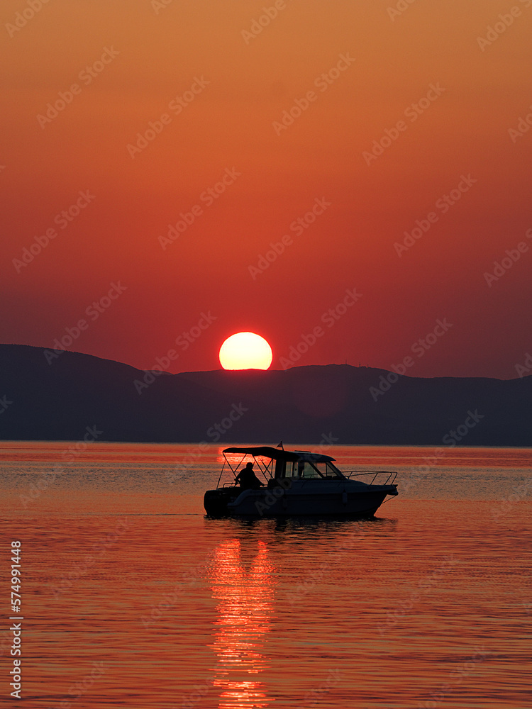 Boat at sunset in Greece