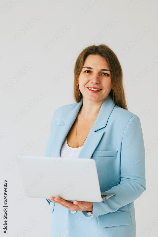 beautiful middle aged real woman portrait with laptop on white background, professional and selfmade businesswoman working online beautiful middle aged real woman portrait with laptop on white background, professional and selfmade businesswoman working online