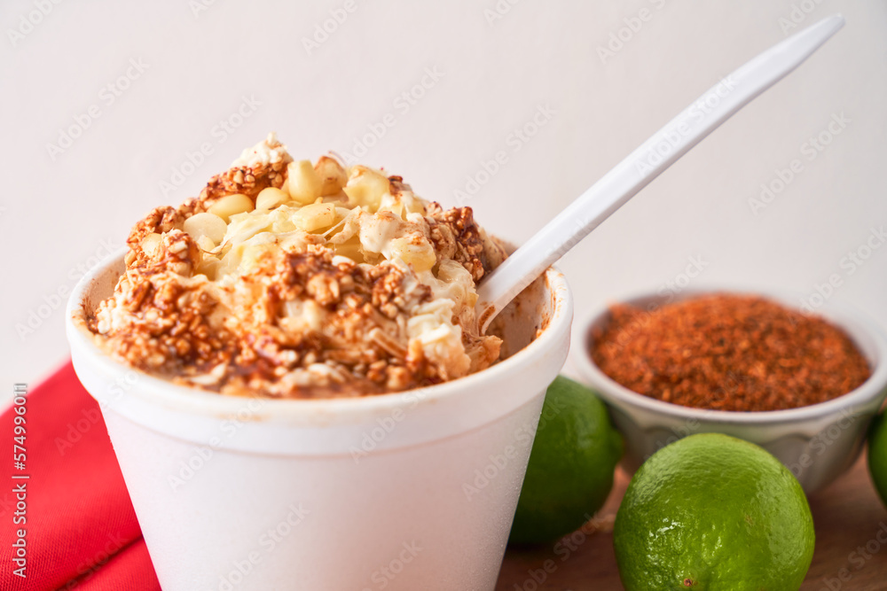 Mexican snack, prepared esquite, corn in a cup, with chili Stock Photo